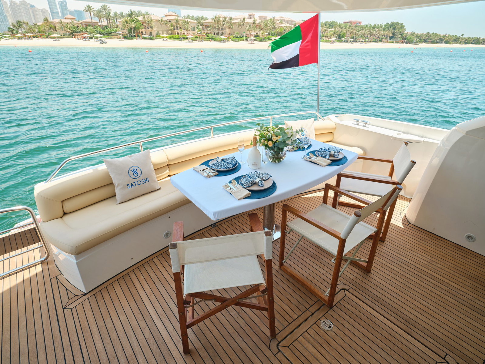 Aft deck dining area setup on luxury yacht charter in Abu Dhabi marina