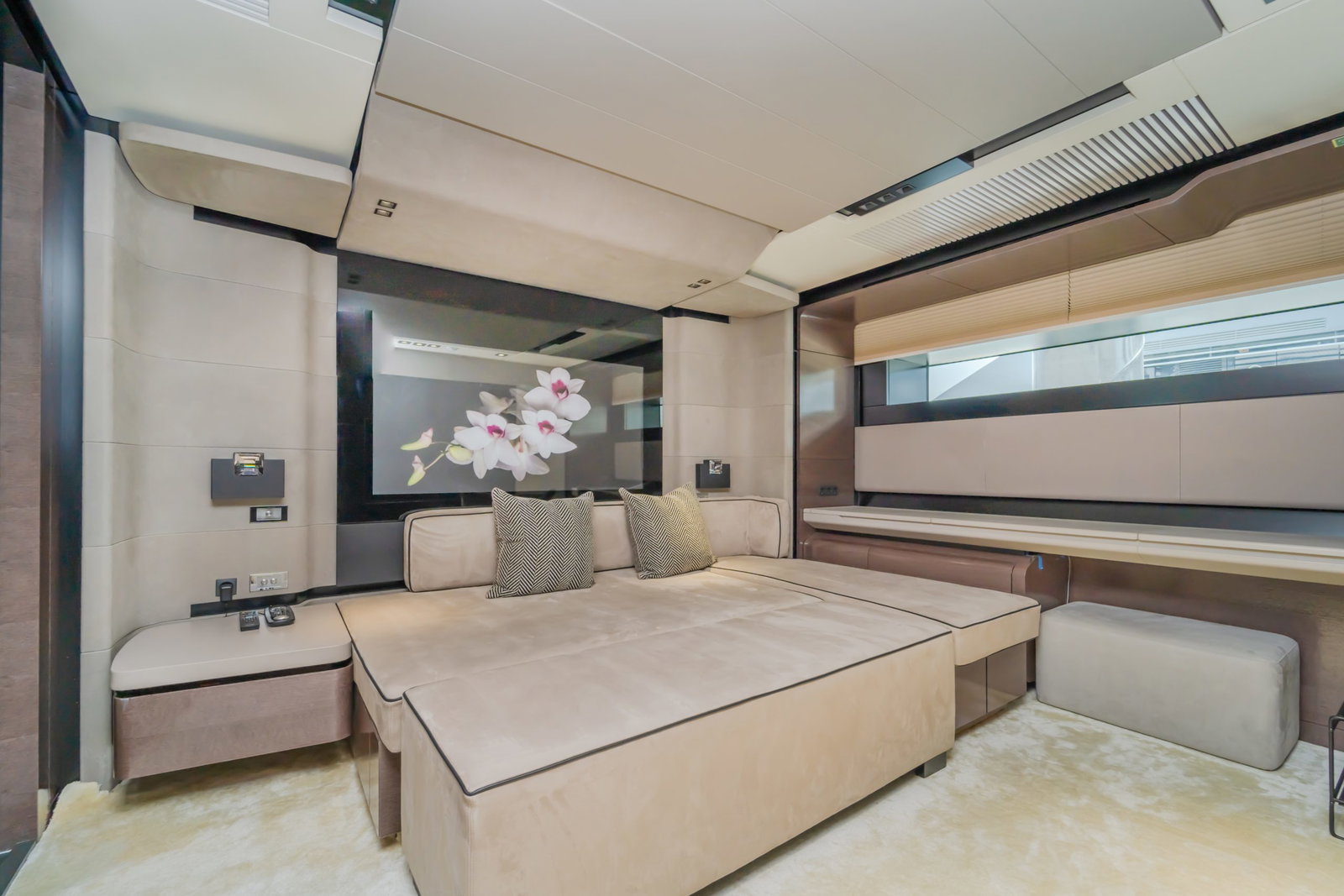 Saffuriya VIP yacht guest cabin with double bed, soft lighting, modern décor and panoramic side windows