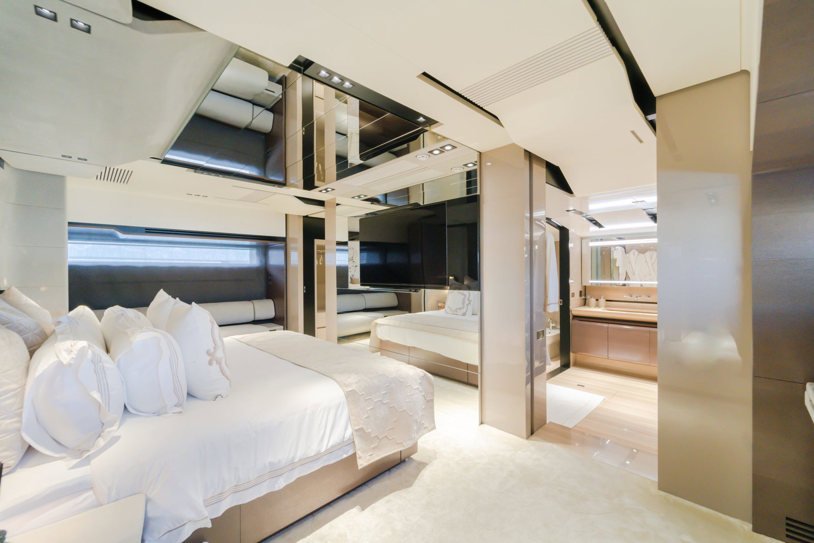 Saffuriya VIP yacht master suite with premium bedding, mirrored panels and elegant ambient lighting