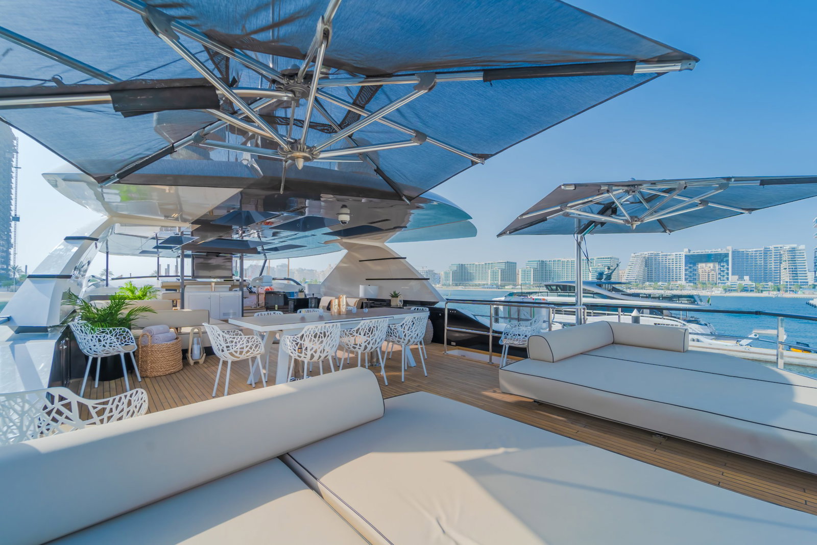 Saffuriya VIP yacht aft deck dining area with shaded seating, marina views and spacious outdoor layout