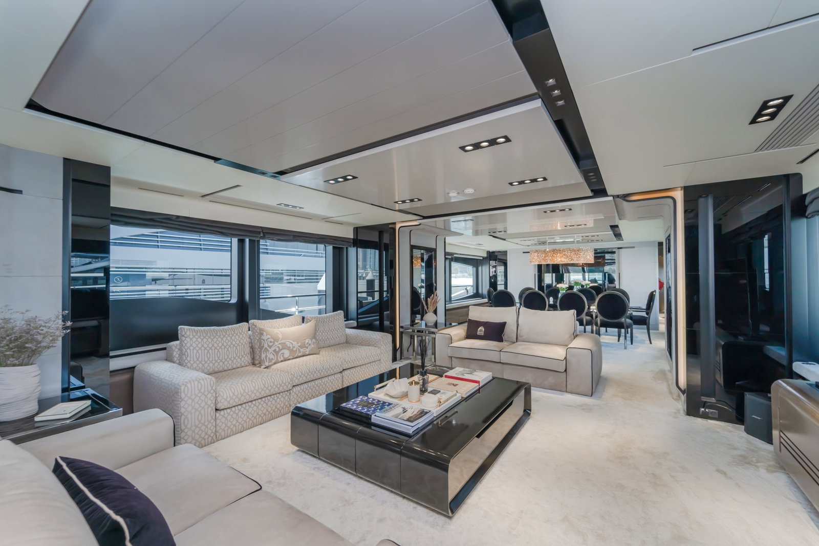 Saffuriya VIP yacht main salon with plush seating, contemporary décor, ocean views and spacious lounge layout