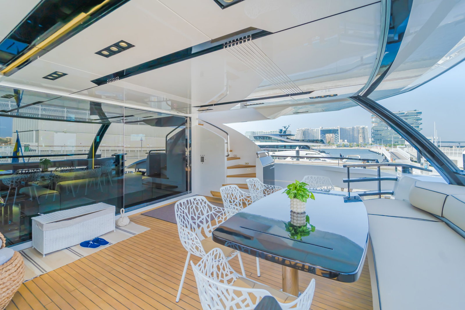 Saffuriya VIP yacht outdoor dining area with modern table setting, marina views and elegant deck design