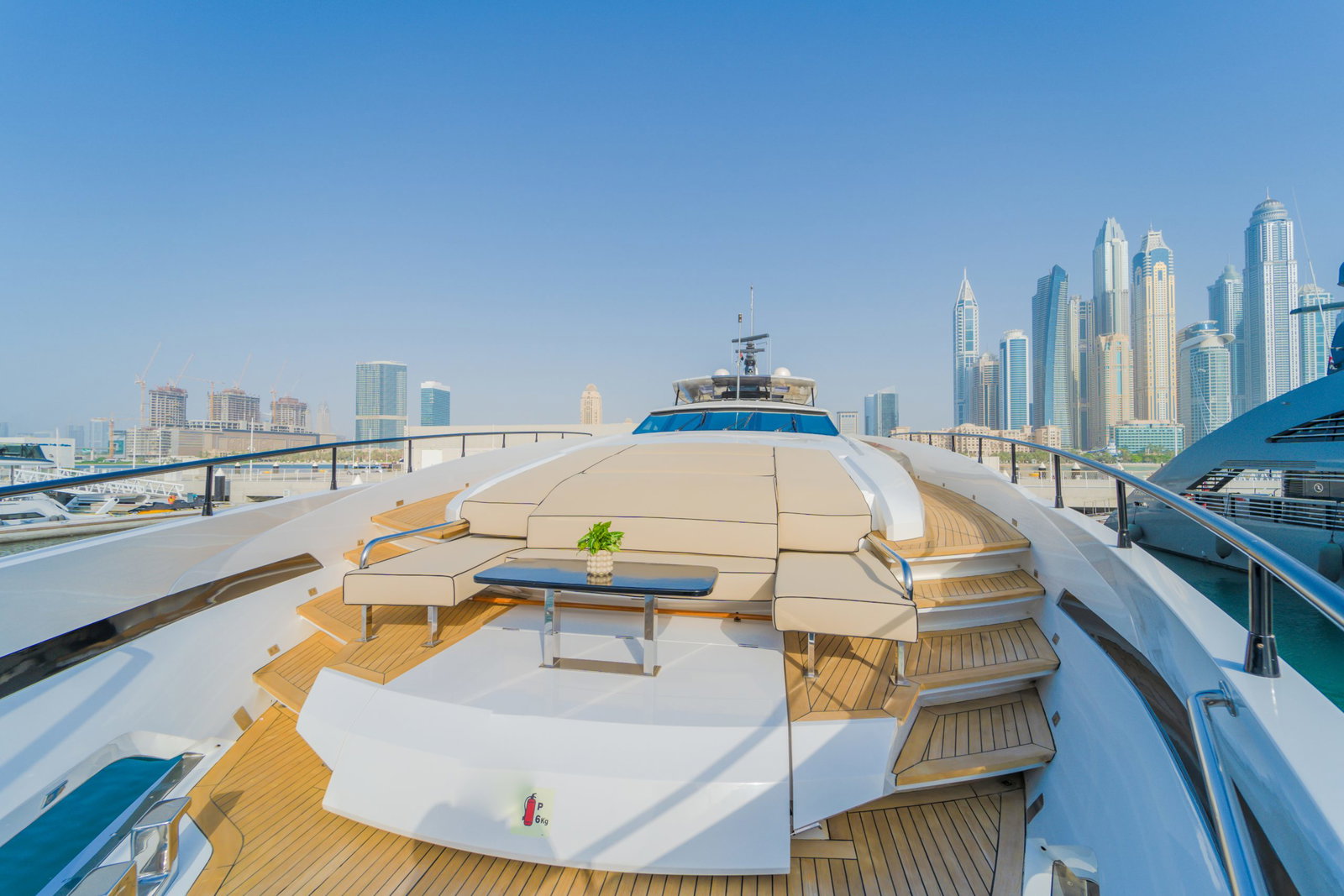 Saffuriya VIP yacht sun deck with circular lounge seating, open sky views and modern outdoor relaxation space