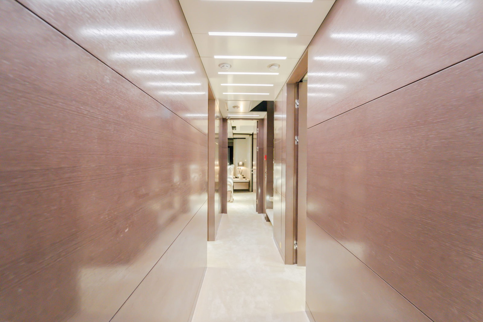 Saffuriya VIP yacht interior hallway with polished walls, soft ceiling lighting and modern corridor design