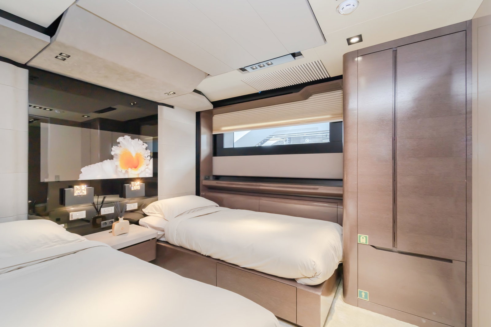 Saffuriya VIP yacht twin guest cabin with modern design, soft bedding and panoramic window views