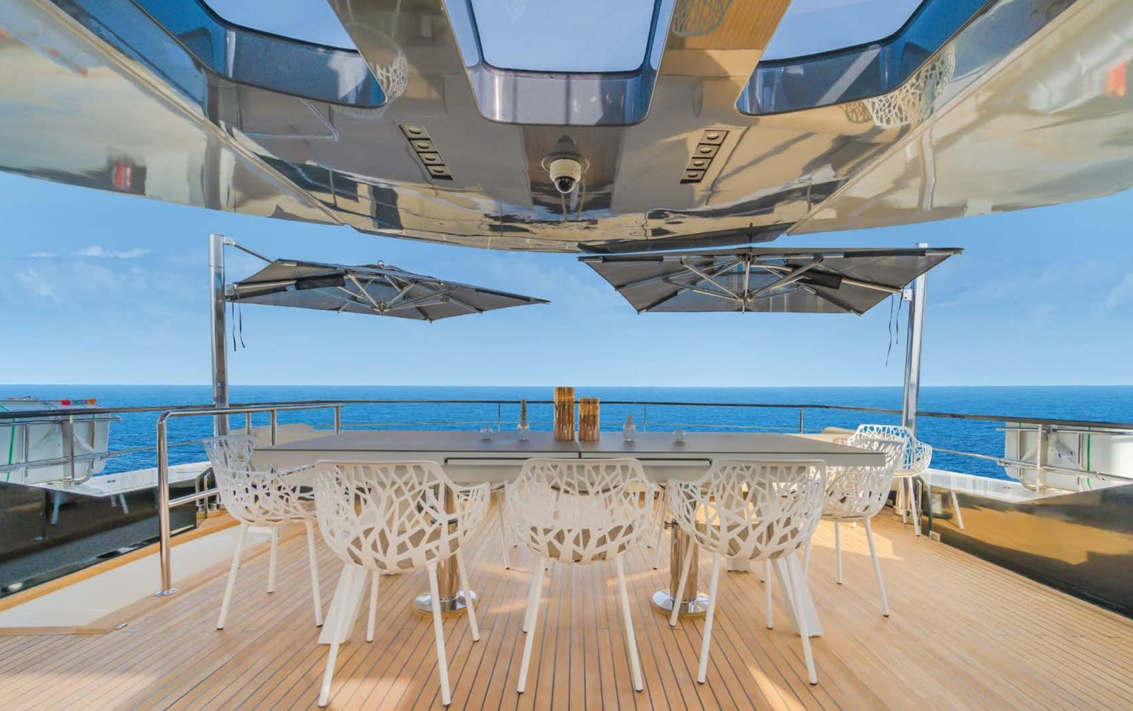 Saffuriya VIP yacht upper deck dining area with shaded canopy, teak flooring and open sea views