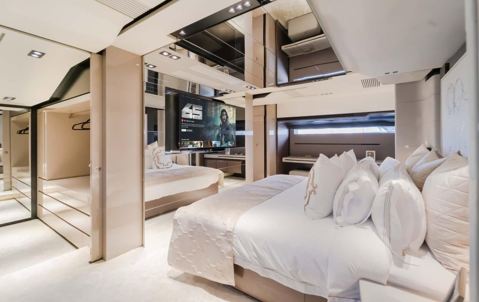 Saffuriya VIP yacht luxury master cabin suite with premium bedding, mirrored panels and refined décor