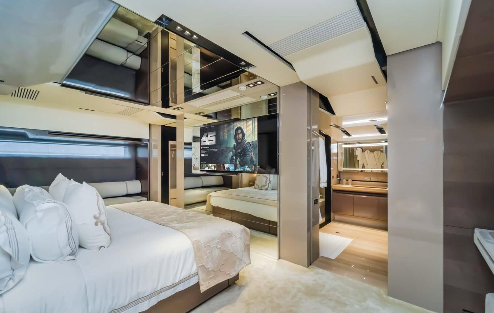 Saffuriya VIP yacht master suite with premium bedding, mirrored panels, wood finishes and elegant lighting