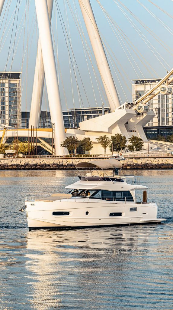 Azimut 50 Miguería luxury yacht cruising on Dubai waters with modern skyline in the background