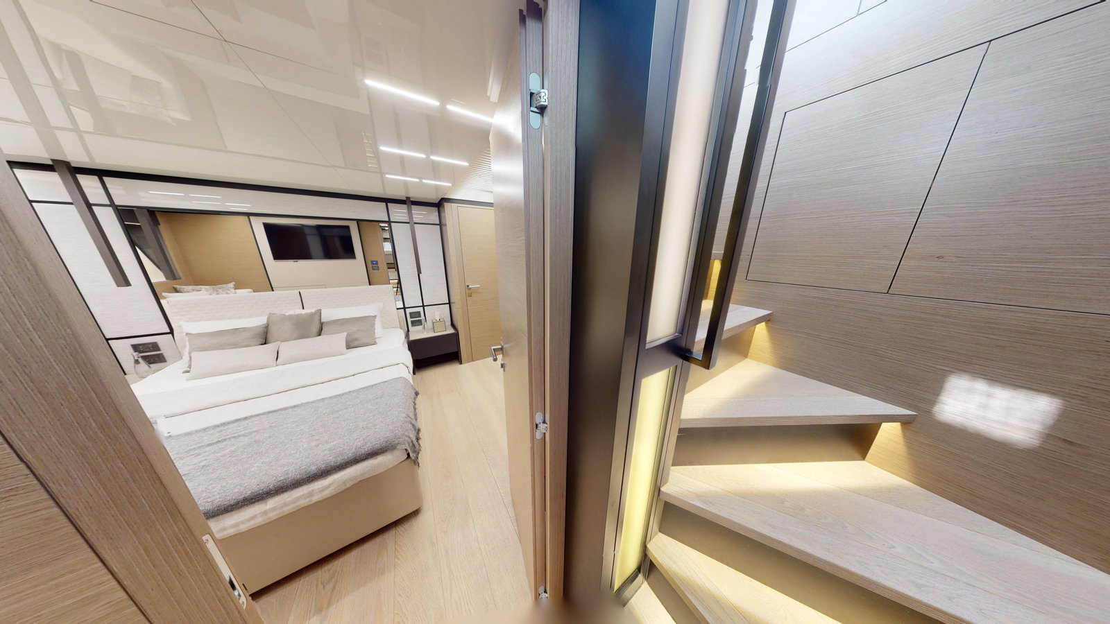 Ferretti 780 interior staircase leading to lower deck cabins