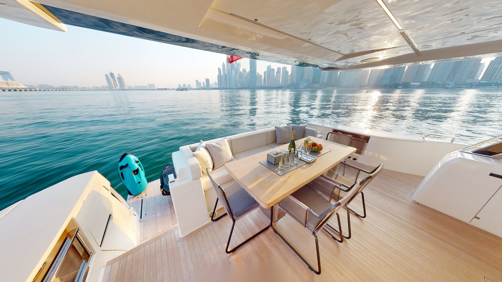 Ferretti 780 yacht outdoor dining area with Dubai skyline view