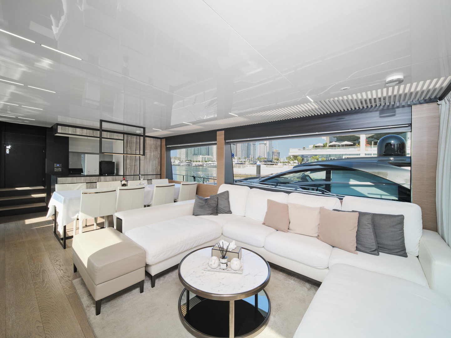 Main salon seating area on Ferretti 780 yacht with panoramic windows