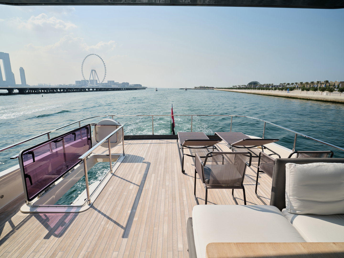 Aft deck dining area on Ferretti 780 yacht with marina view