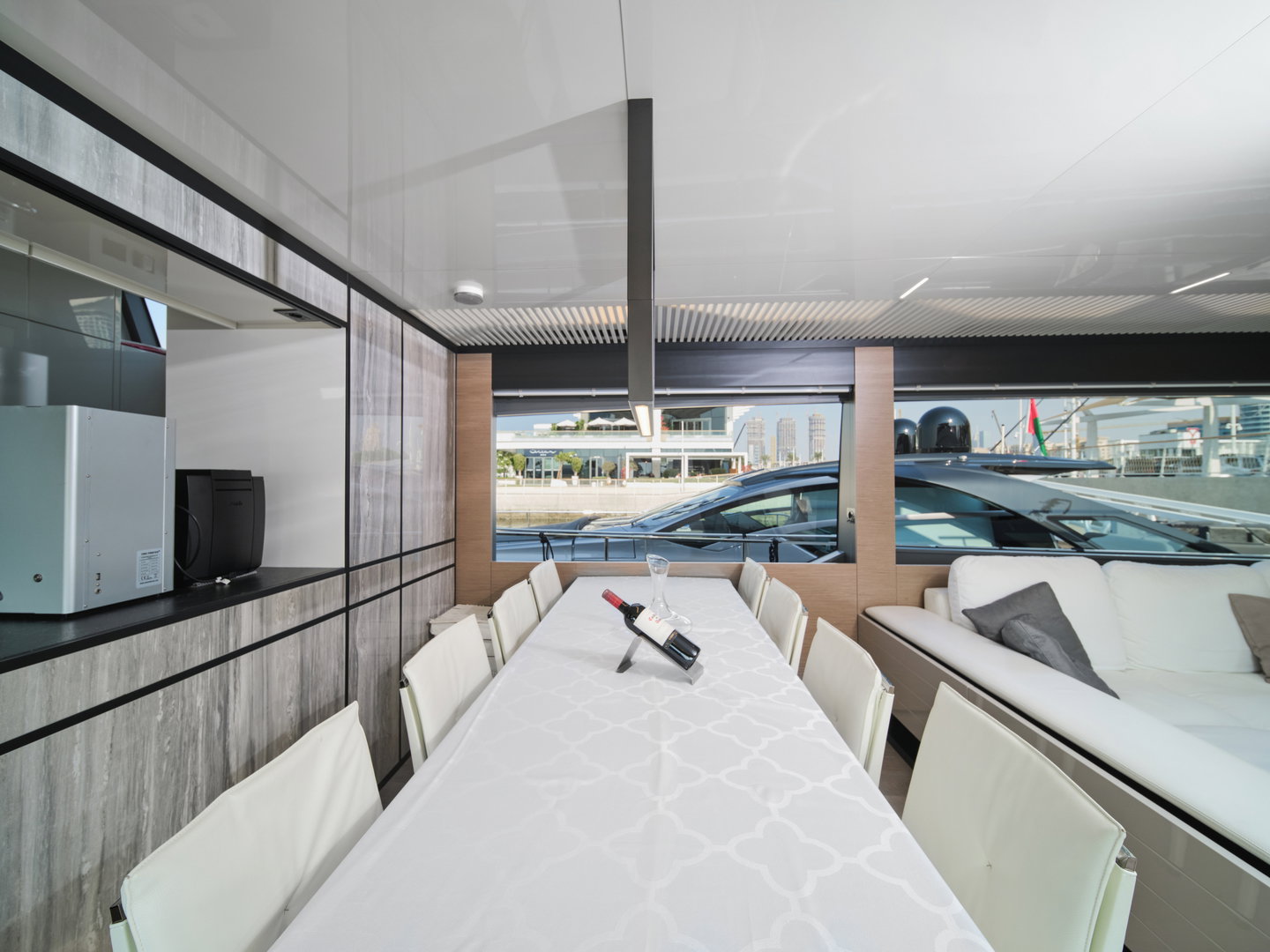 Indoor dining area on Ferretti 780 yacht with modern table setup