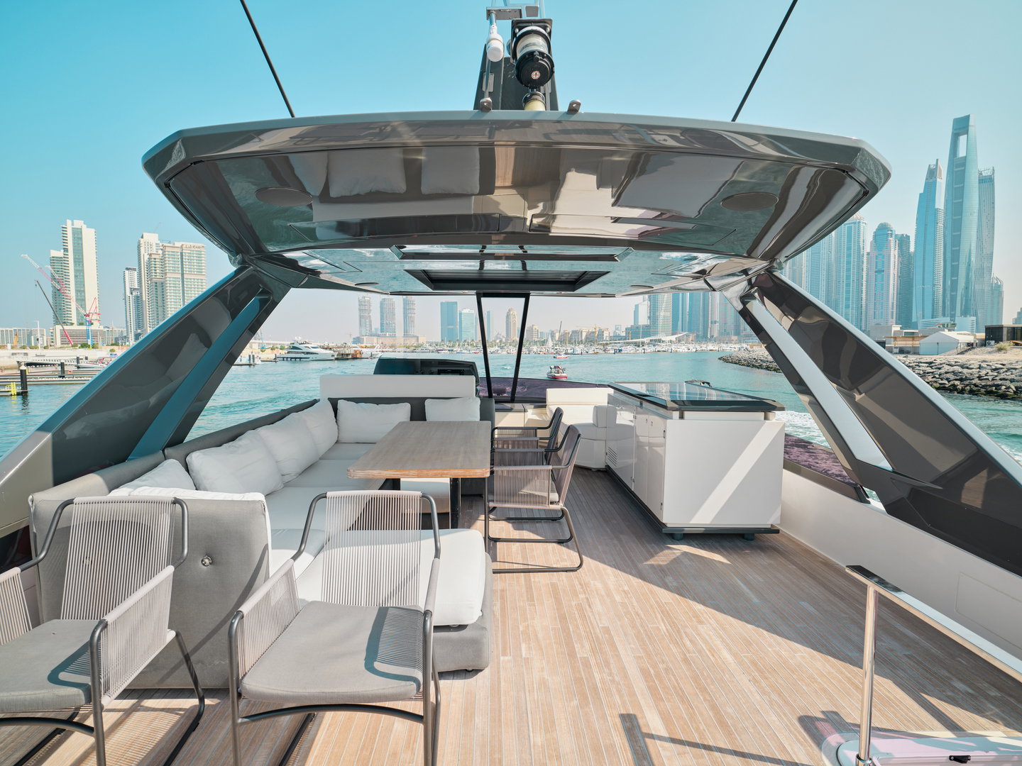 Flybridge lounge on Ferretti 780 yacht with seating and open-air design