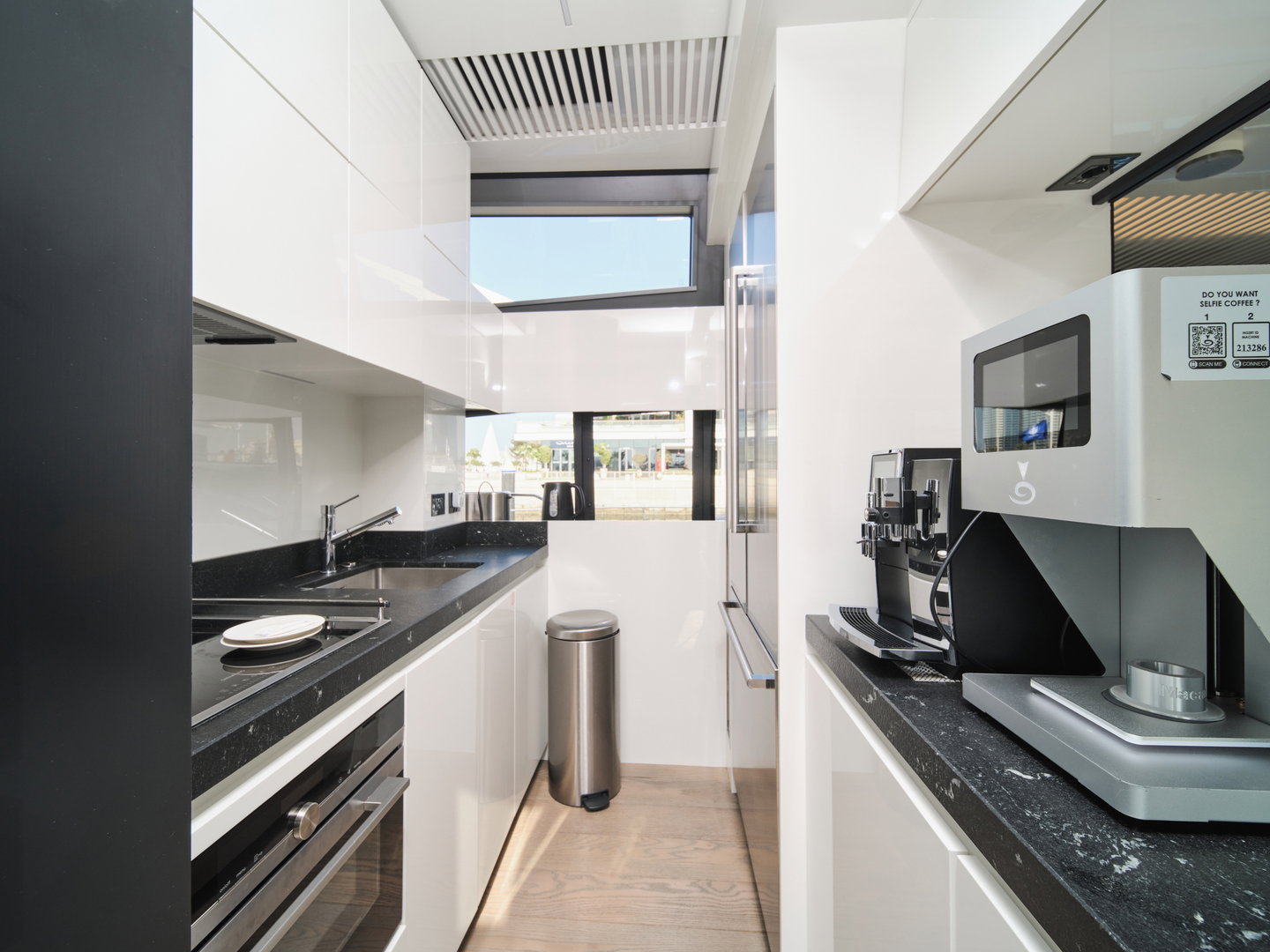 Modern galley kitchen on Ferretti 780 yacht with appliances