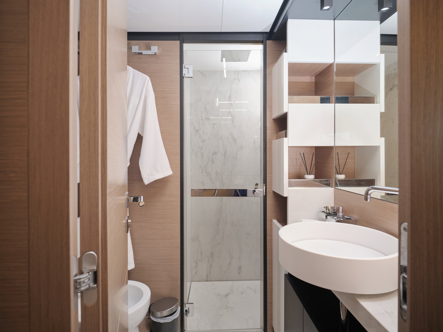 Ferretti 780 luxury yacht cruising on open water near coastline