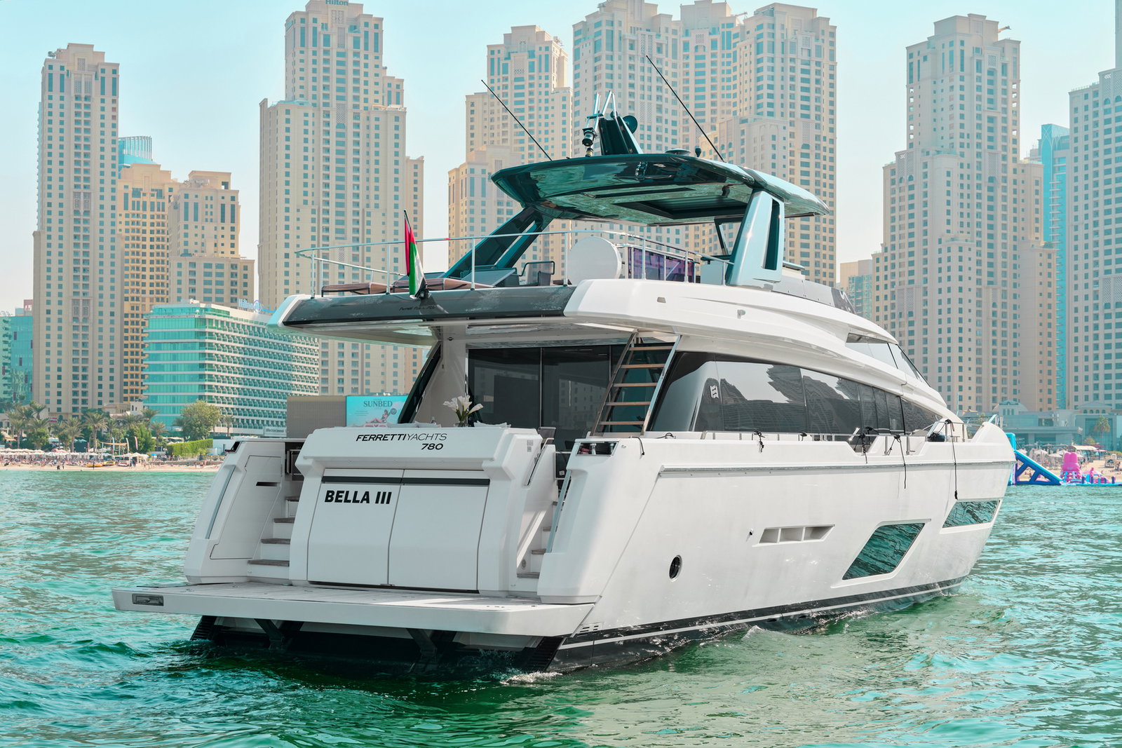 Ferretti 780 luxury yacht stern view near Dubai skyline