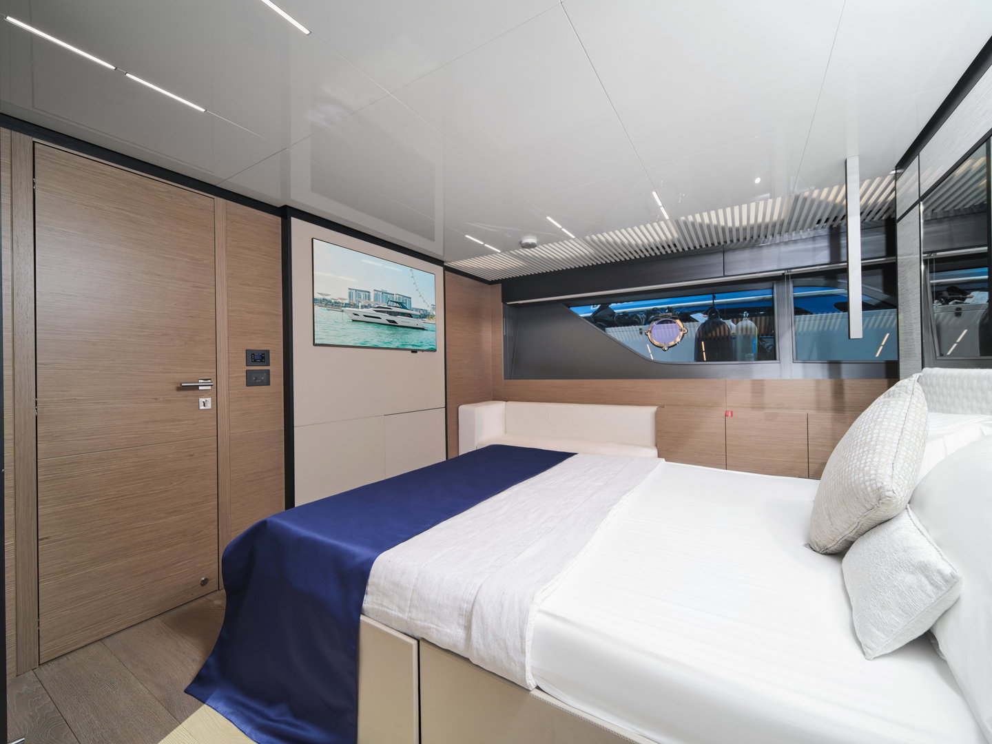 Interior master cabin on Ferretti 780 yacht with large bed and modern decor