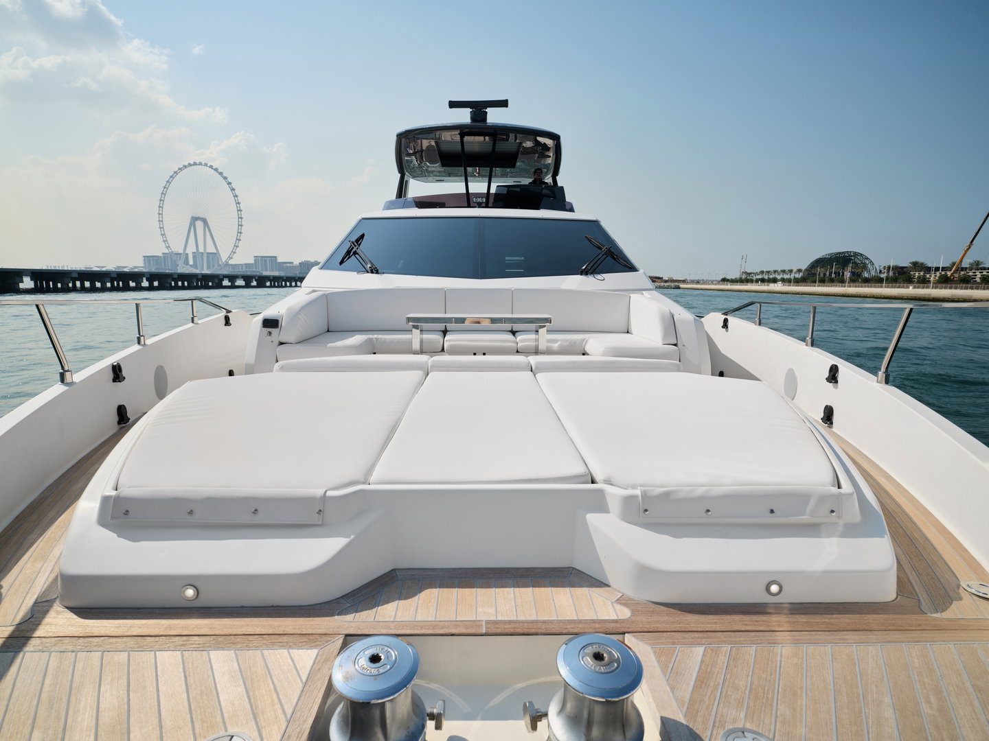 Bow sunbathing area on Ferretti 780 yacht with cushioned loungers