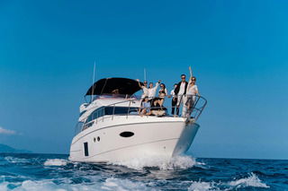 Group enjoying a luxury yacht experience in Dubai on a sunny day
