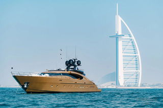 Luxury yacht cruising near Burj Al Arab in Dubai waters
